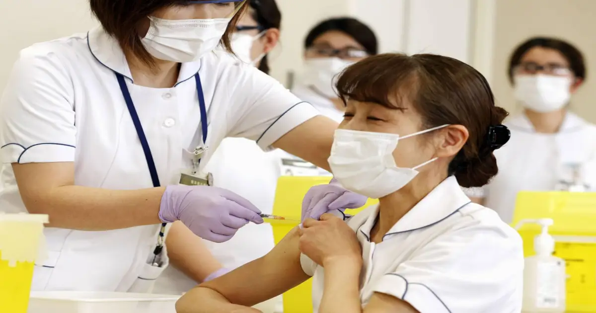Japan starts booster COVID vaccinations amid omicron scare